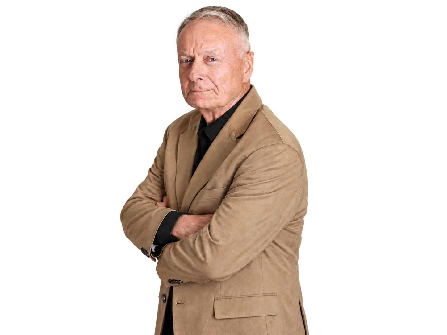 Tom Johnson, co-author, in a tan blazer with arms crossed